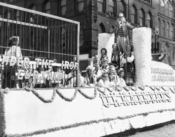 1948, August 15. AA. FREEDOM. Among the many picturesque floats in Centennial parade was this Ukrainian entry depicting a caged woman under the 