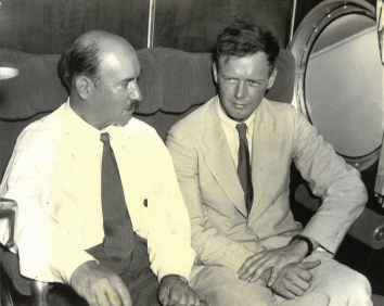 1934, July 3. BA. Bridgeport, Connecticut. LINDBERGH PILOTS GIANT S-42 IN TEST.  Colonel Charles A. Lindbergh (right), designer of the giant 18-ton transport plane built for the Pan American Airways primarily for Trans-Atlantic service, the S-42, shown in the plane before its test flight at Bridgeport, Conn., July 3. AP Photo (Front)