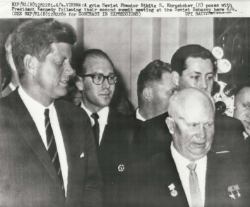 1961, June 4. DA. Vienna, Austria. A grim Soviet Premier Nikita S. Khrushchev poses with President Kennedy following their second summit meeting at the Soviet Embassy here June 4. UPI Radiotelephoto (Front)